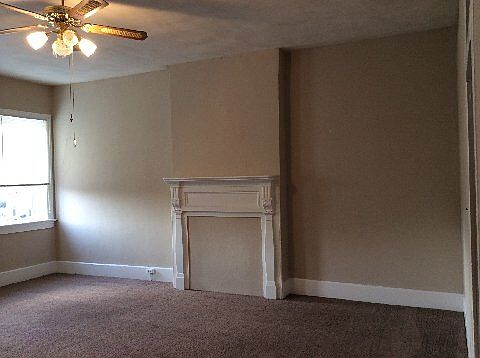 Master Bedroom- Faux fireplace, lots of light & windows. Big