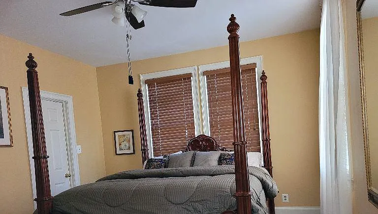 King size cherry poster bed with all bedding, sheets, towels, supplied.