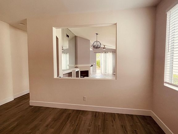 View of living/dining room from den