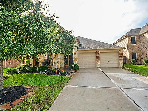 Beautiful stone elevation with front porch and covered entry