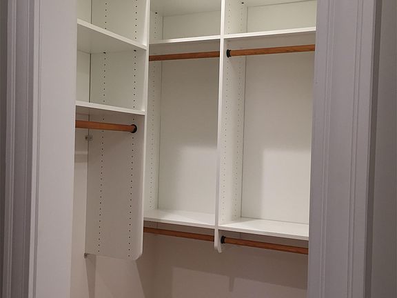 Walk-in closet in Master Bedroom in Unit A. 11 linear feet of hanging space!
