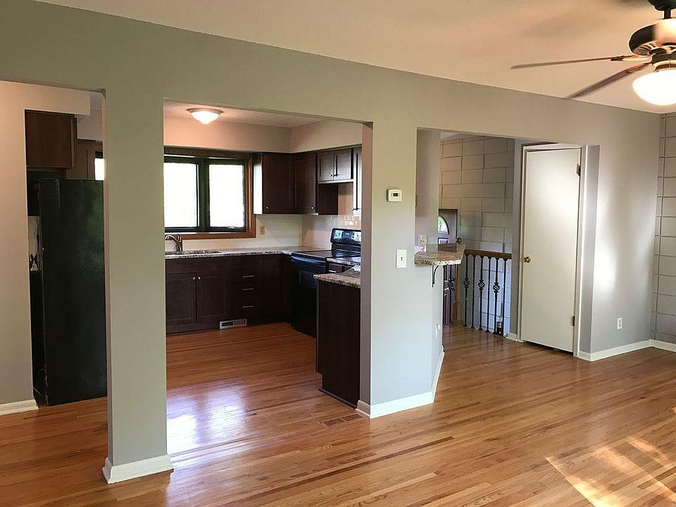 new kitchen with granite counter tops and open to livingroom
