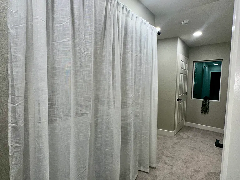 Second-Floor Hallway with Hidden Laundry Area