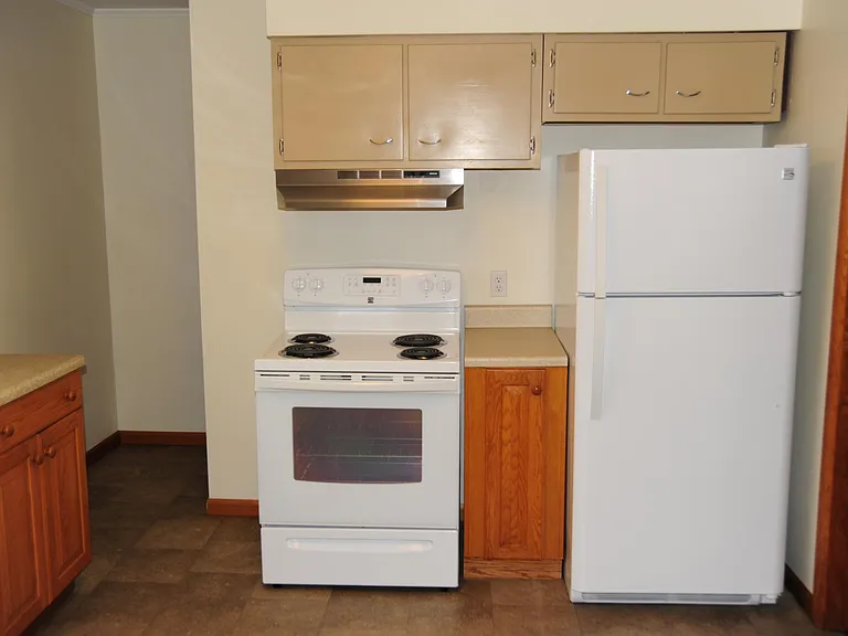 Refrigerator/stove in kitchen