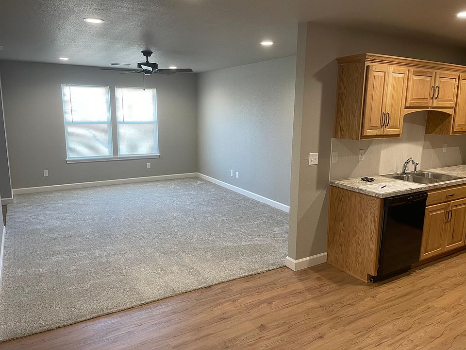 Full view of living room from dining area/kitchen
