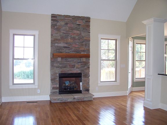 Great room with hardwoods and stone gas fireplace