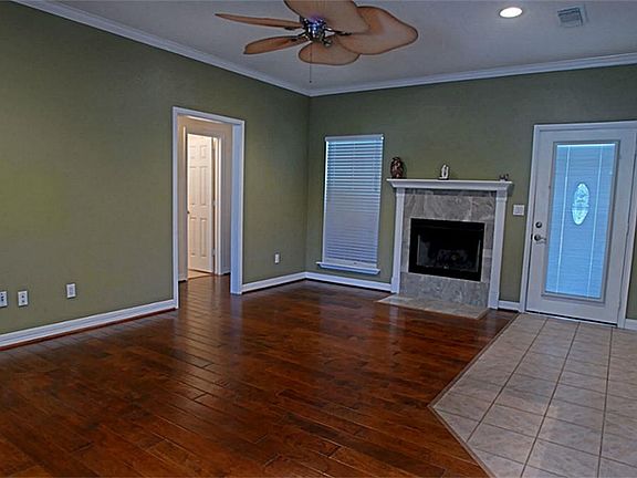 The interior of this home will impress you!!!  Enjoy gleaming wood floors, soft color palate, recessed lighting, crown molding, decorative ceiling fan, 2 in blinds, tile floors, and spacious living areas.