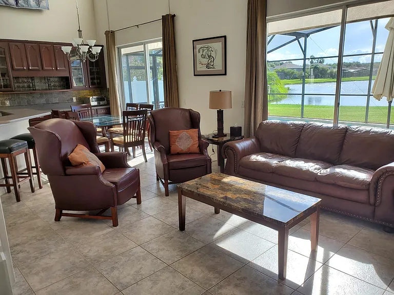 Double oversized sliding doors look out over west facing pool and private lake and put on a never ending bird and wildlife show.