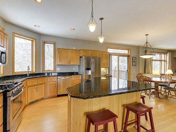 Stainless appliances, granite countertops, spacious breakfast bar