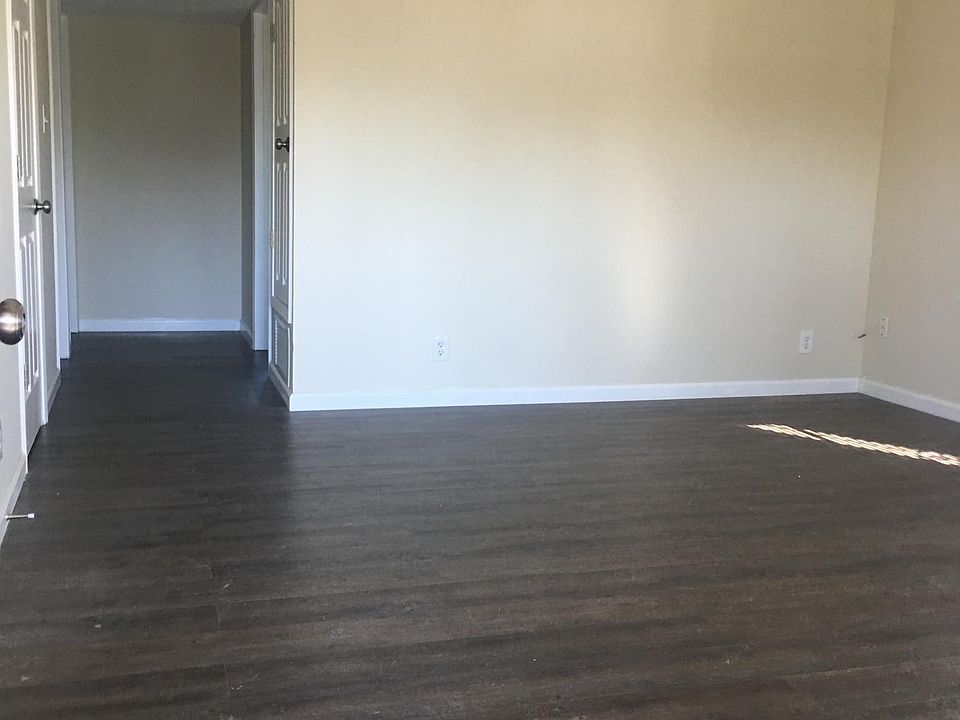 Living room all new flooring throughout apartment.