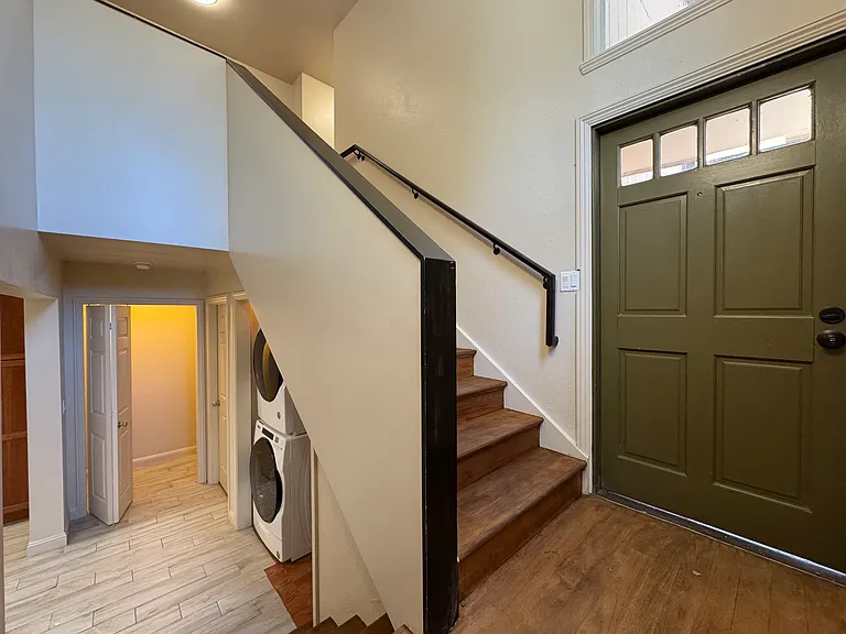 Front door with stairs to top floor or stairs to bottom floor