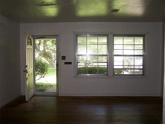 Living area with hard wood flooring