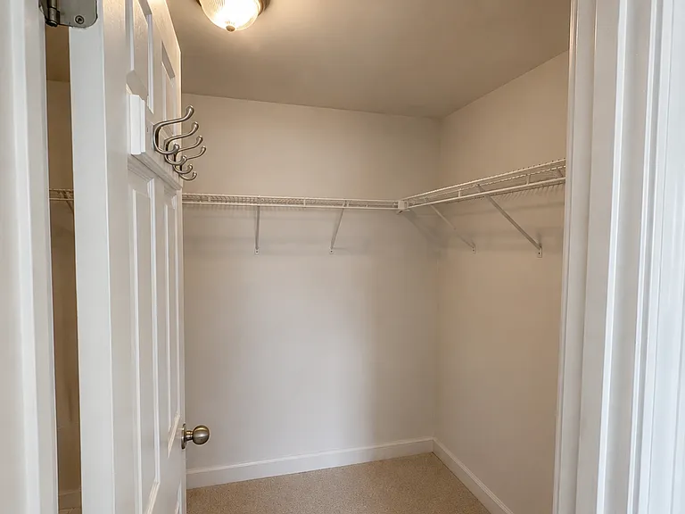 Walk in primary bedroom closet