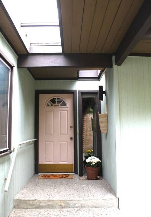 A skylight covered walkway leads through the courtyard to the front door.
