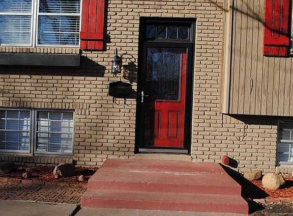 OUTSIDE ENTRYWAY WITH DESIGNER LIGHT FIXTURES, CUSTOM GLAZED DOOR, STORM DOOR,