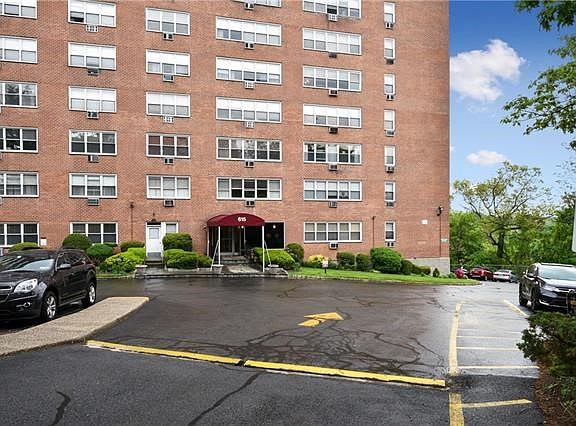 Front of 615 Building with assigned outdoor and indoor parking