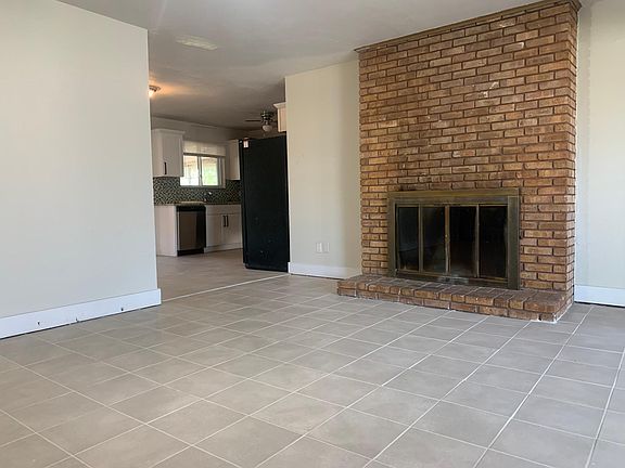 Wood burning fireplace and new tile floors.