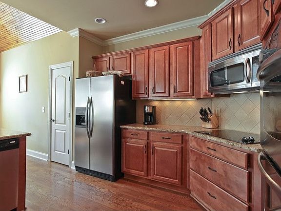 Kitchen Is Beautifully Detailed with Stainless Appliances, Double Oven.