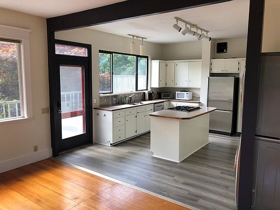 Light, bright kitchen with a door to the large south facing deck.