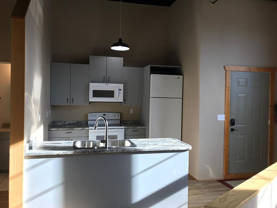 Updated Kitchen Including: New Flooring, Counter, Stove, Microwave, Sink/Faucet.