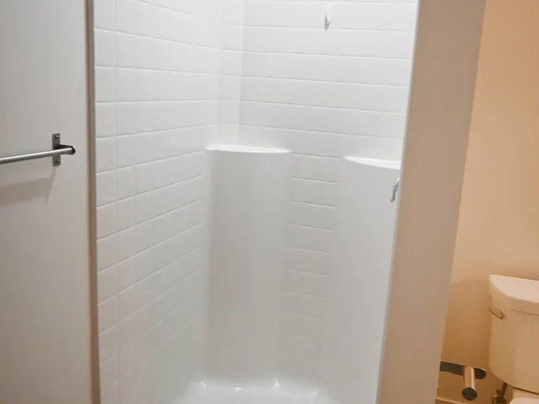 Walk-in shower in a unit at The Sawyer.