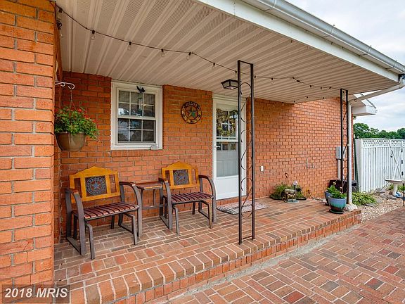 Small brick porch off side of home