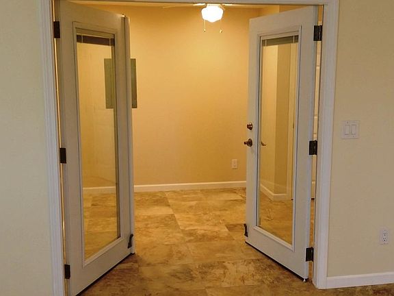 The bonus room off of the living space, with French doors