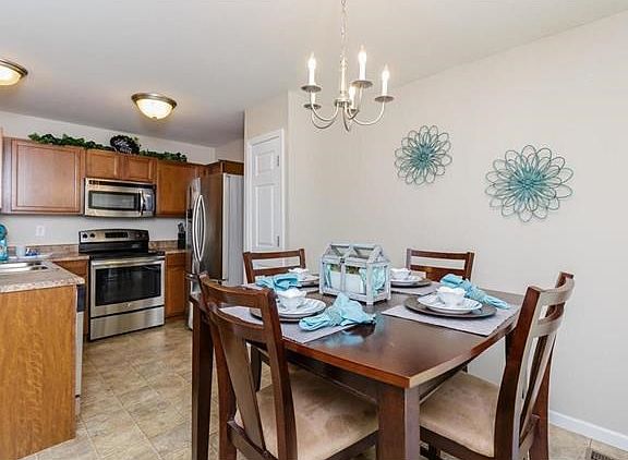 Kitchen with breakfast room allows plenty of wonderful meals to be prepared on these stainless appli