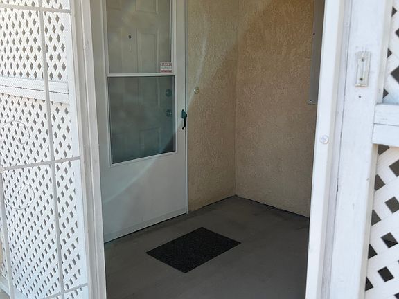 Front door to 3 bedroom side of home