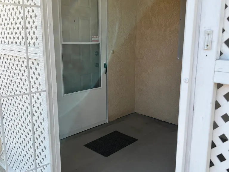 Front door to 3 bedroom side of home
