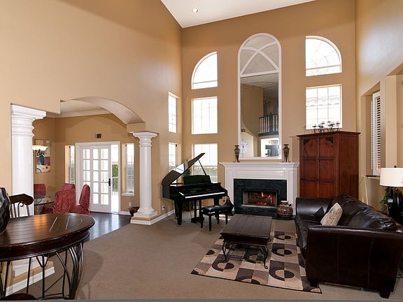 Grand entryway, living room & dining room
