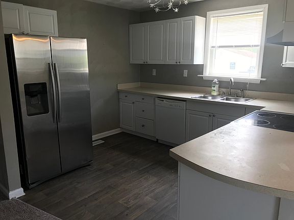 Kitchen with new refrigerator. 