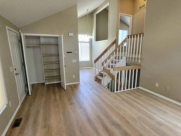 Living room view to stairs and dining area