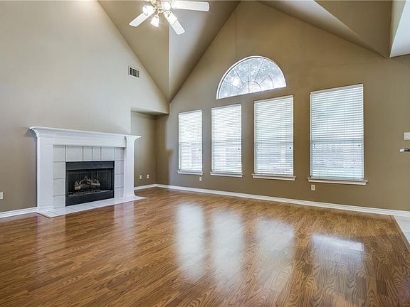 Tall ceilings, gas logs, view of gorgeous tree-lined back yard.