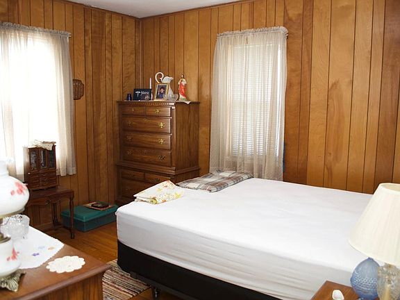 Hardwood floors with brown walls, main floor