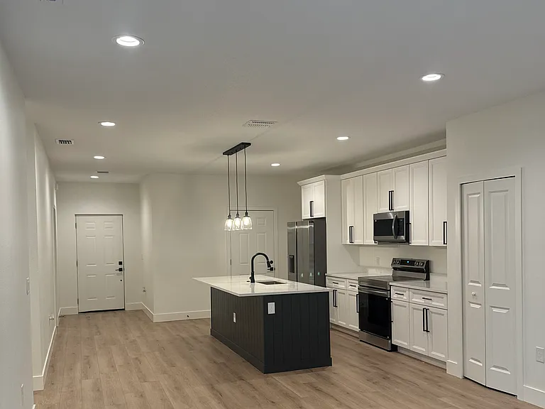 Open concept kitchen and living room.