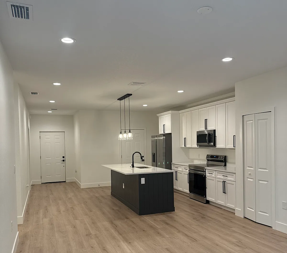 Open concept kitchen and living room. - 40 W 12th St