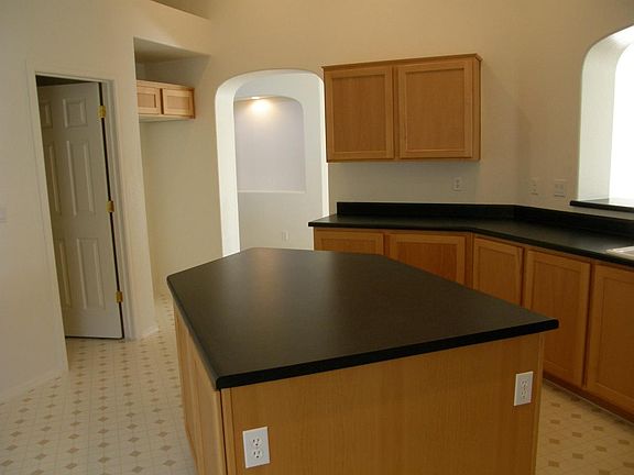 Garage entry through utility room to kitchen