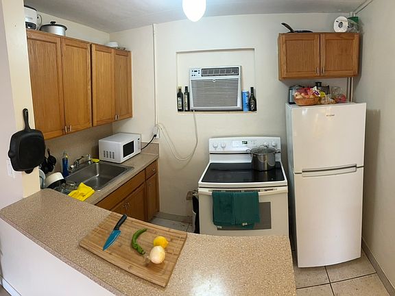 Galley kitchen and eat at bar.