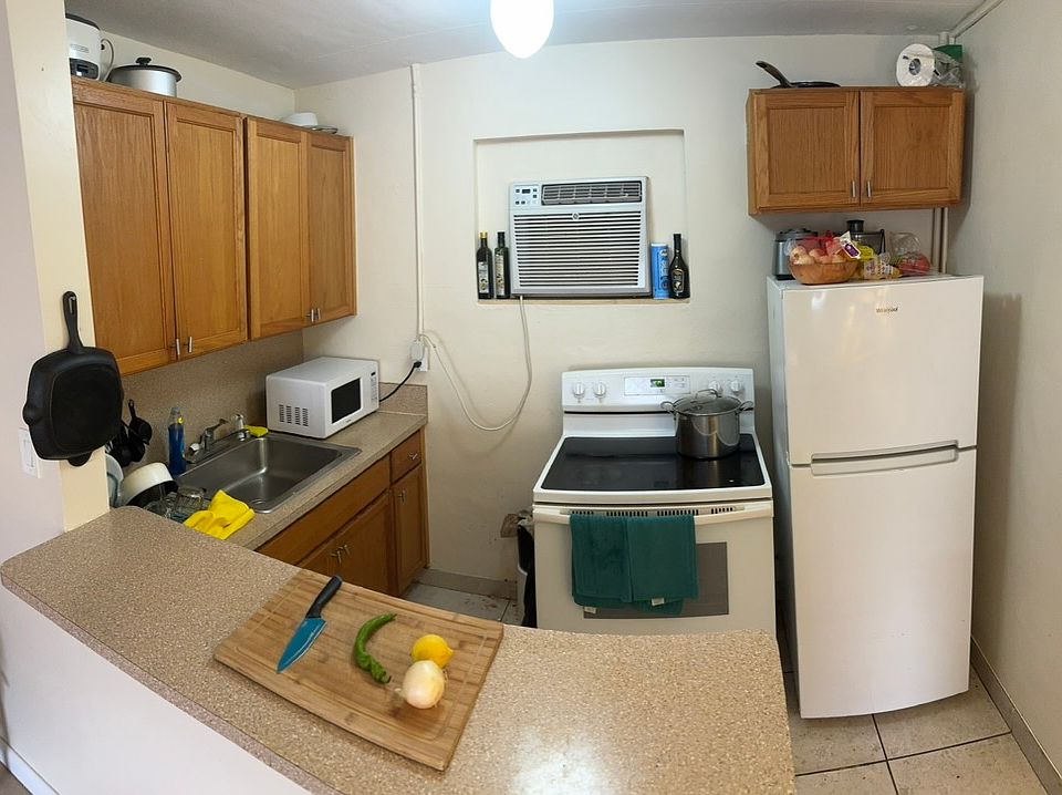 Galley kitchen and eat at bar.