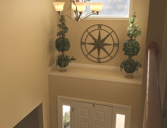 Open foyer with plenty of natural daylight and decorating ledge - new fixture just installed