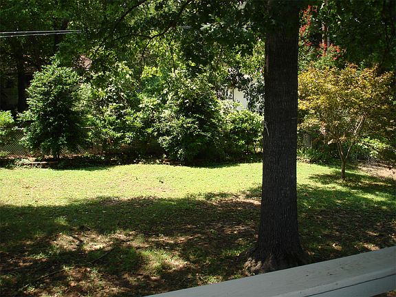 View of fenced yard from back deck.