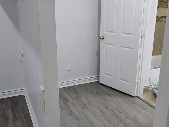 Right side of Master bedroom closet with a closet entrance to Master bathroom. It also has a Master bedroom entrance. Master bathroom has a tub/shower combination, with a sink and toilet.