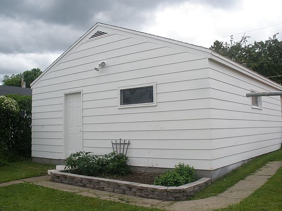 2 car garage from back side of house, car pad to the right.