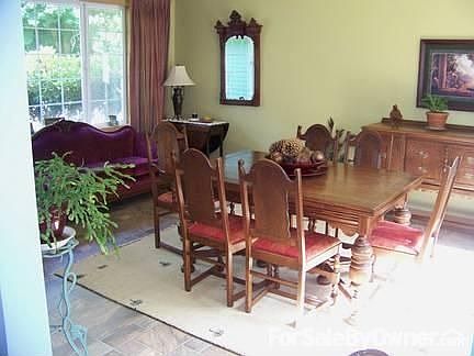 Kitchen with breakfast bar
						:
						Counter depth refrigerator, island hood, 36 inch AGA electric stove.