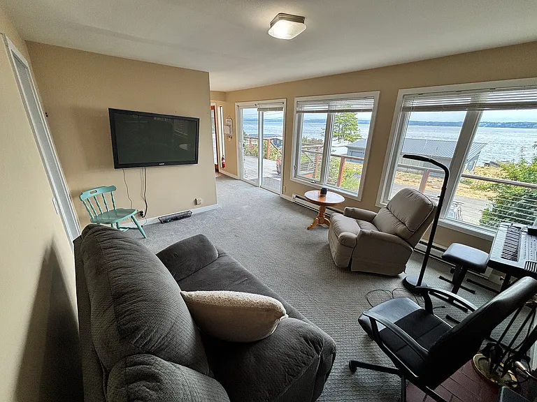 Rec room, with TV and recliners, connected to internet.
