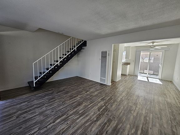 Living room looking into dining area toward patio