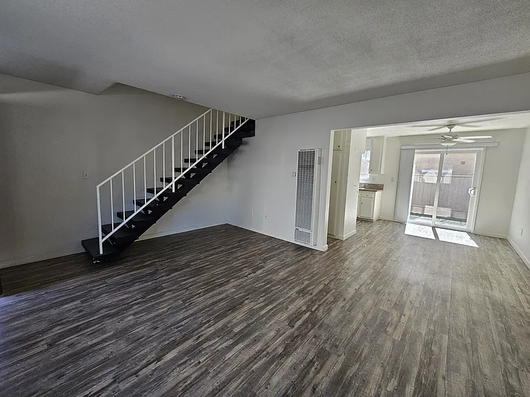Living room looking into dining area toward patio