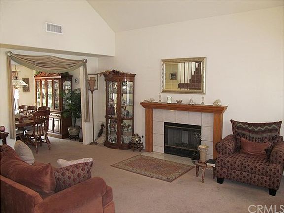 1 of 2 living spaces. Spacious vaulted ceilings. 1 of 2 fireplaces. Bay window.
