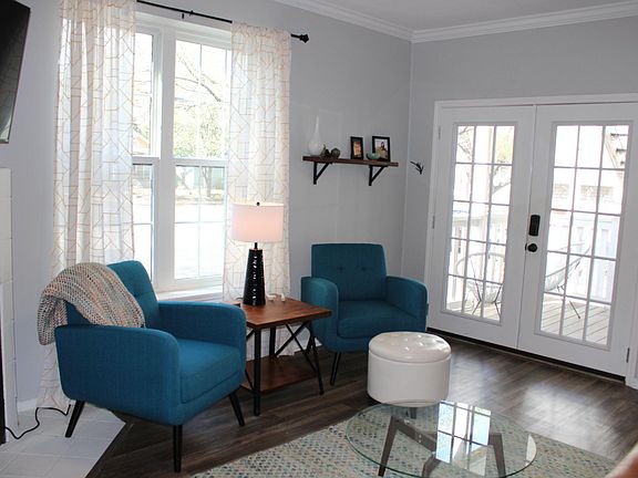 French doors and big windows provide an abundance of natural light